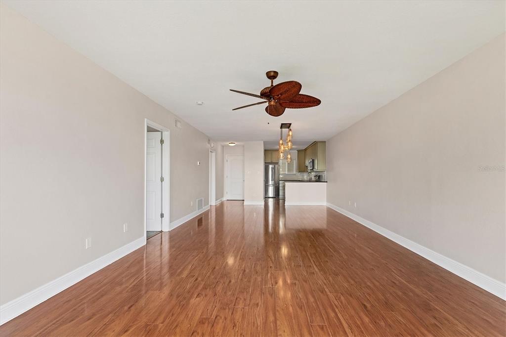 301 South Gulfstream Avenue, Unit 302 Sarasota, FL 34236 - Photo 10 of 25 a view of empty room with wooden floor and fan