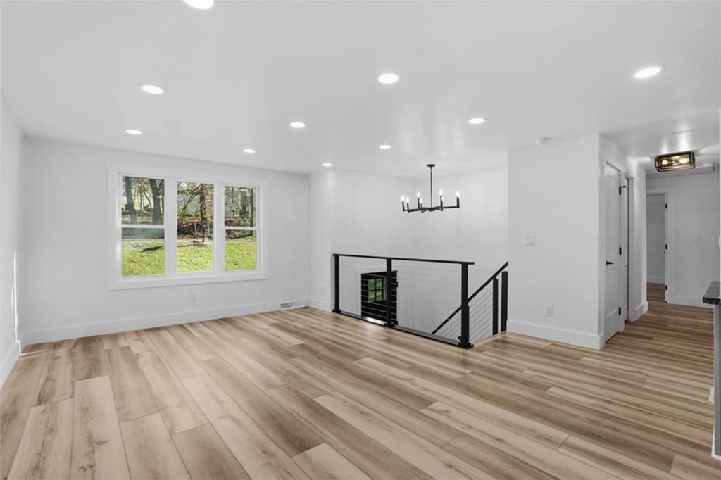 32 Green Oak Drive Coraopolis, PA 15108 - Photo 15 of 40 a view of an empty room with wooden floor and a window