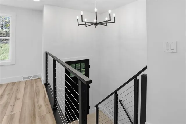 a view of a hallway with stairs