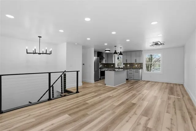 a view of kitchen with wooden floor
