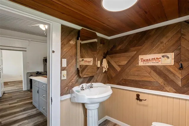 a bathroom with a toilet sink and window