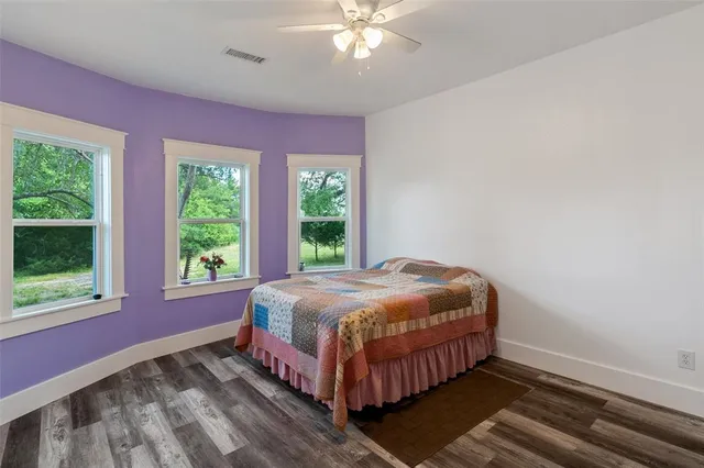 a living room with furniture or chandelier and a flat screen tv