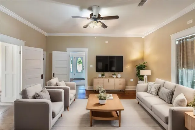 a view of a dining room with furniture and wooden floor