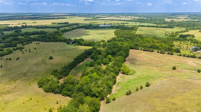 a view of a lake with a yard
