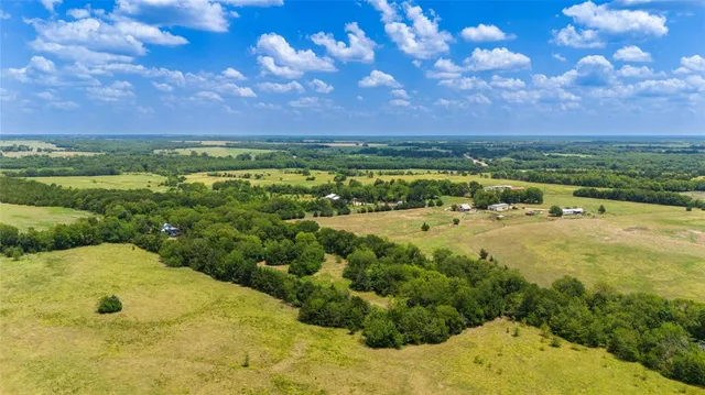 a front view of a house with a yard in front of it