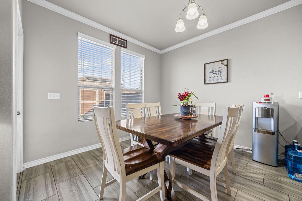 1021 Pasadena Street Portland, TX 78374 - Photo 13 of 37 a view of a dining room with furniture window and wooden floor