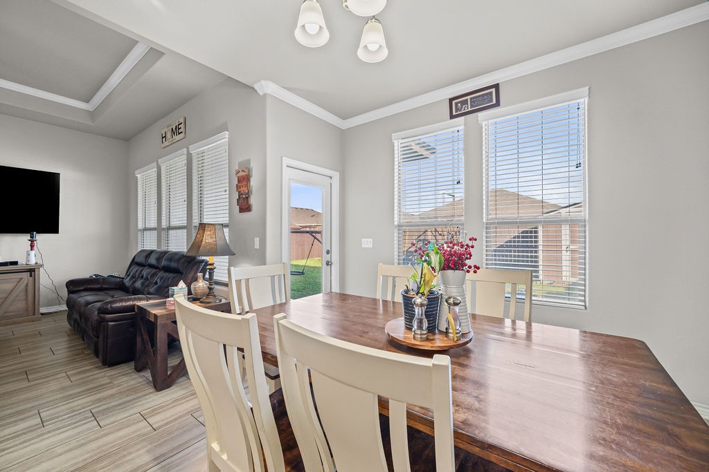 1021 Pasadena Street Portland, TX 78374 - Photo 14 of 37 a view of a dining room with furniture window and wooden floor