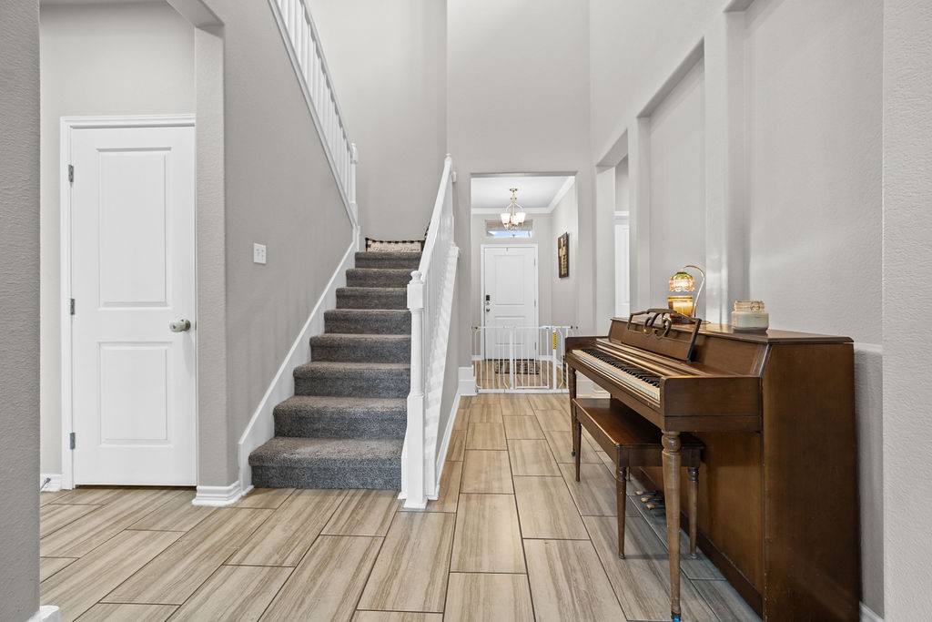 1021 Pasadena Street Portland, TX 78374 - Photo 15 of 37 a room with wooden floor and stairs