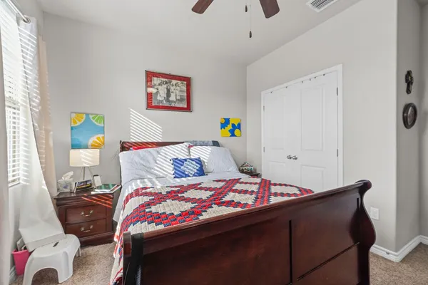 a bedroom with a bed and a television