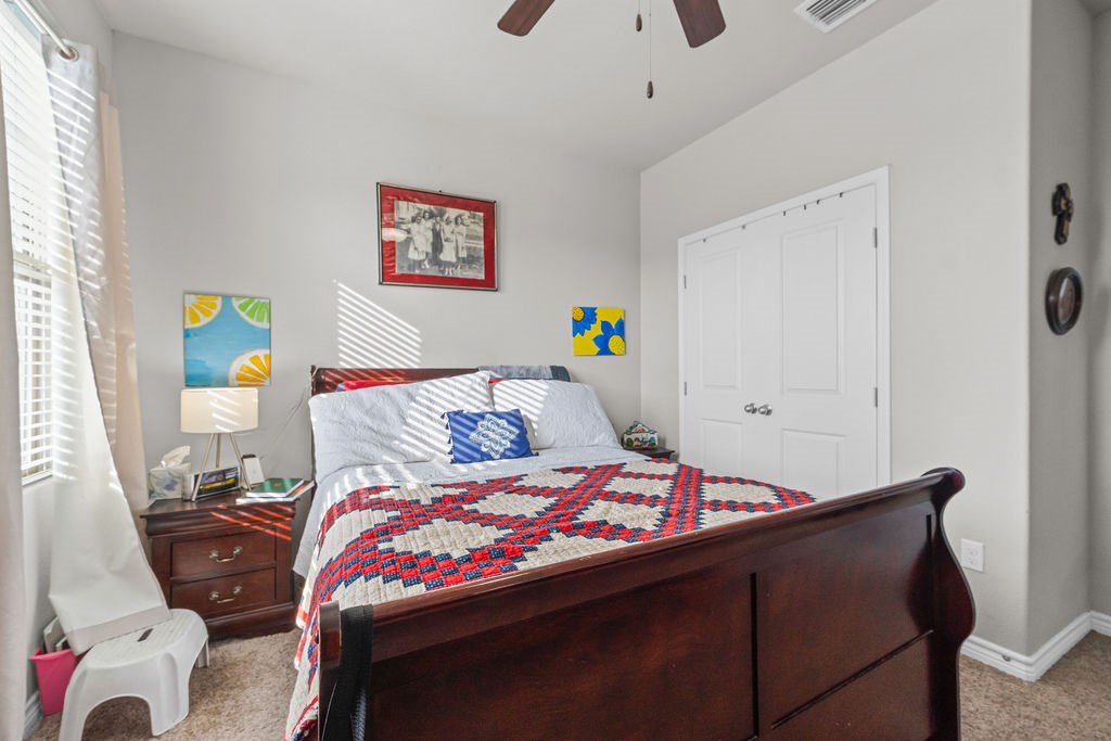1021 Pasadena Street Portland, TX 78374 - Photo 17 of 37 a bedroom with a bed and a dresser