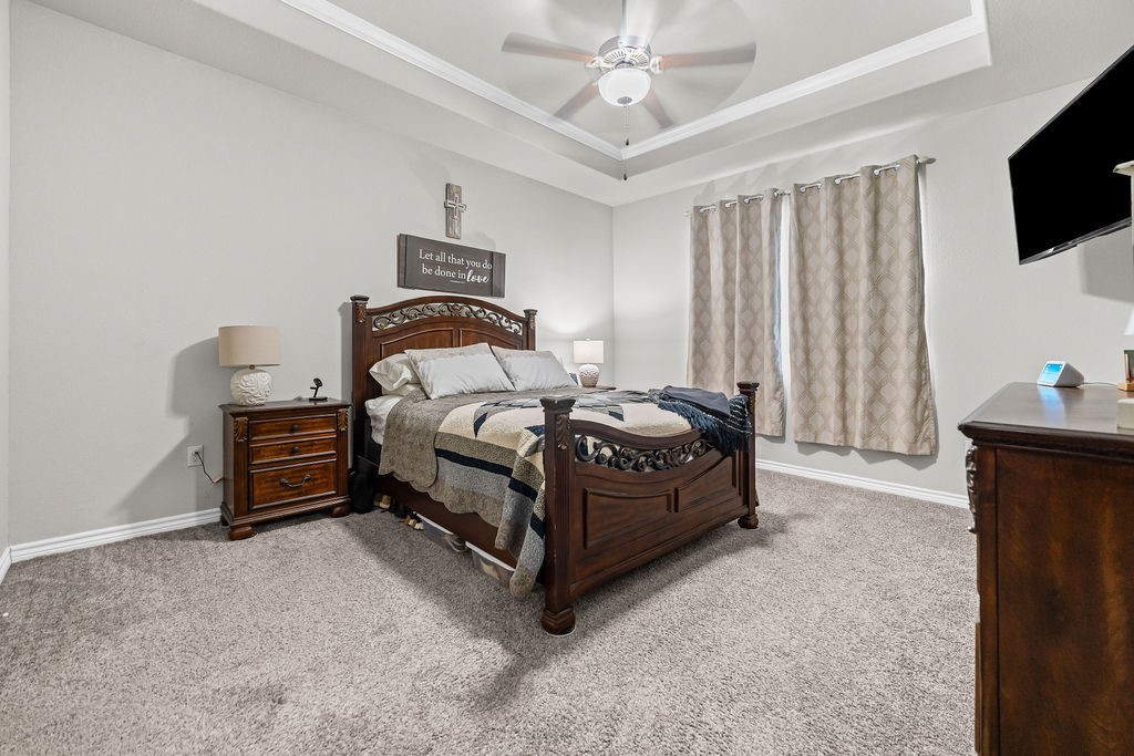 1021 Pasadena Street Portland, TX 78374 - Photo 19 of 37 a bedroom with a bed and a television