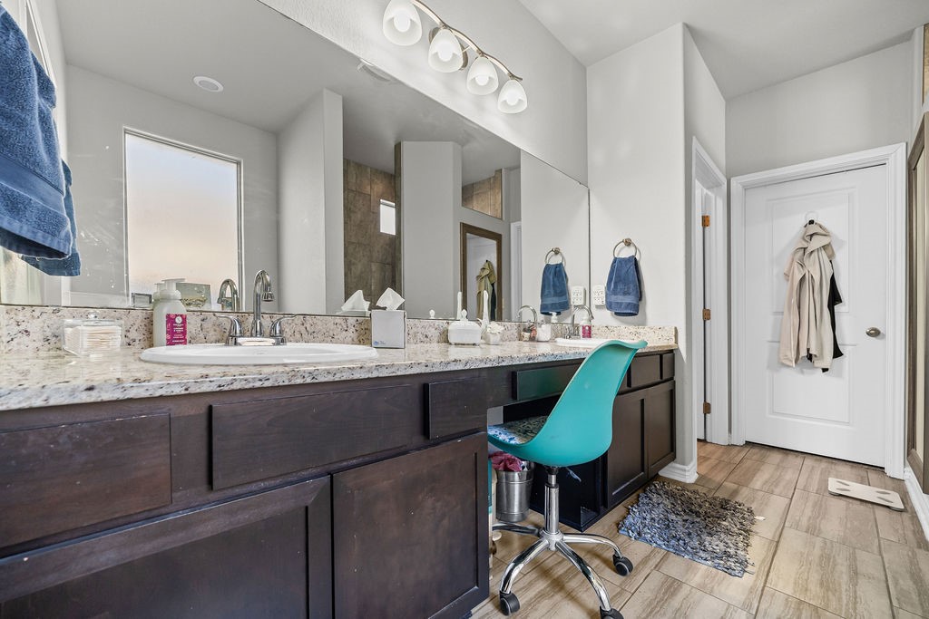 1021 Pasadena Street Portland, TX 78374 - Photo 23 of 37 a bathroom with a sink and a mirror