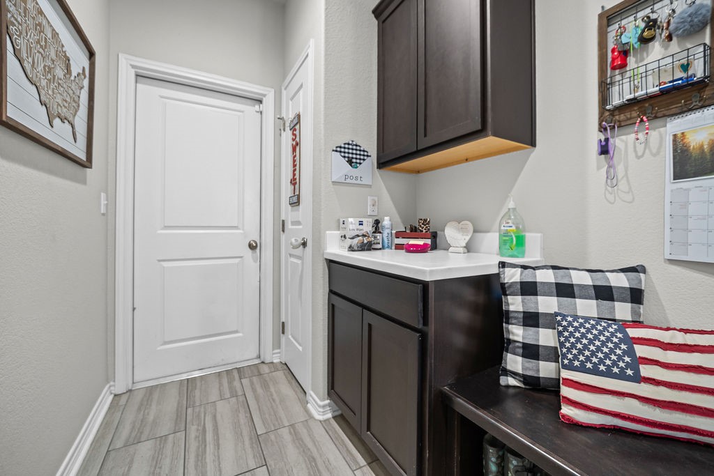 1021 Pasadena Street Portland, TX 78374 - Photo 26 of 37 a kitchen with a sink and cabinets