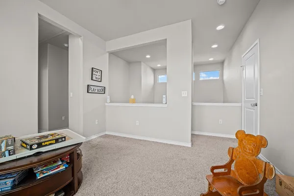 a bedroom with a bed and a fireplace