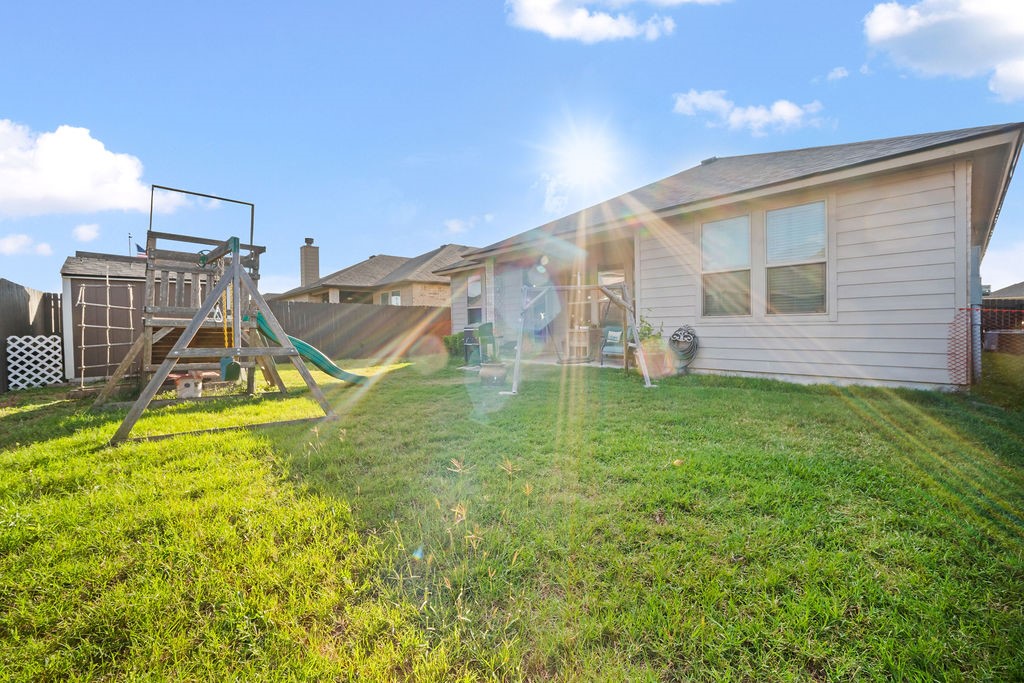 1021 Pasadena Street Portland, TX 78374 - Photo 36 of 37 a view of a house with a backyard