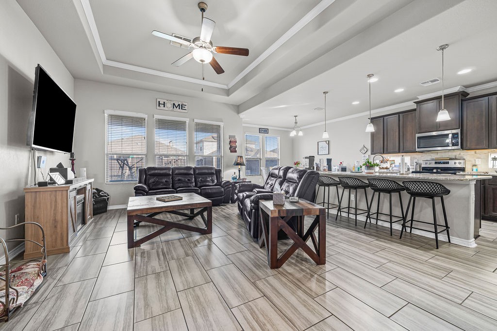 1021 Pasadena Street Portland, TX 78374 - Photo 4 of 37 a living room with stainless steel appliances kitchen island granite countertop a stove and a wooden floors