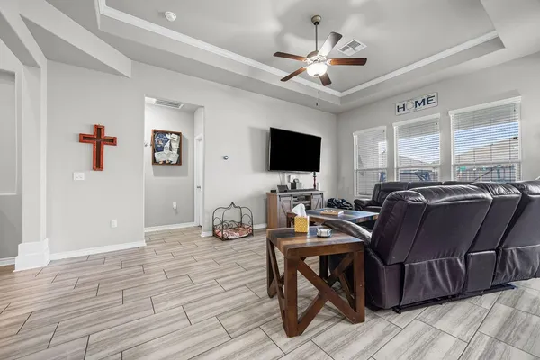 a living room with furniture kitchen view and a table