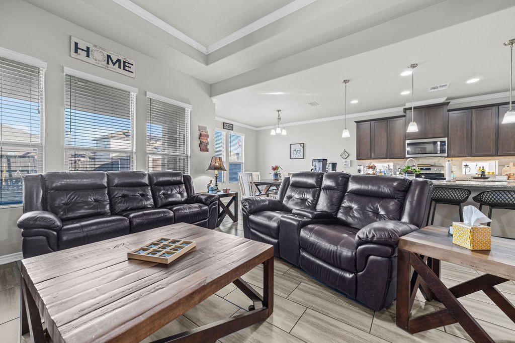 1021 Pasadena Street Portland, TX 78374 - Photo 6 of 37 a living room with furniture kitchen view and a table