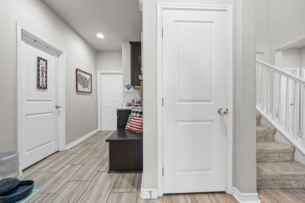 1021 Pasadena Street Portland, TX 78374 - Photo 8 of 37 a view of a hallway with wooden floor and staircase