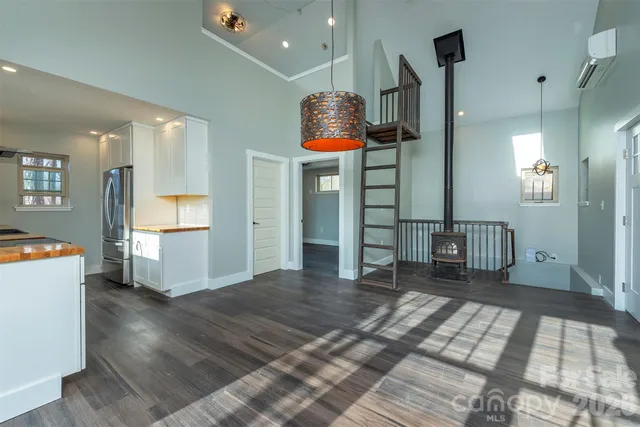 a bedroom with furniture and window