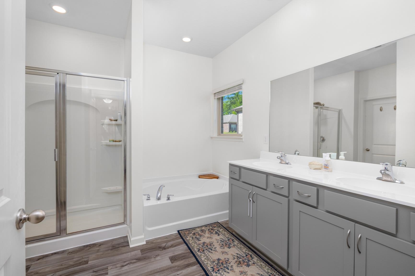 5132 Shellback Drive Millington, TN 38053 - Photo 15 of 24 a bathroom with a double vanity sink mirror and shower