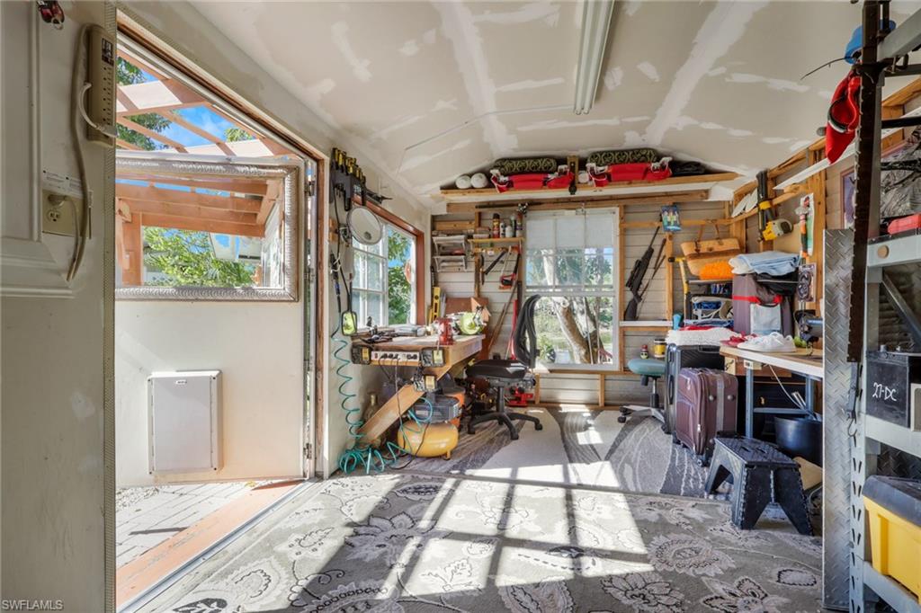 4983 18th Court Southwest Naples, FL 34116 - Photo 13 of 37 a view of a room with gym equipment