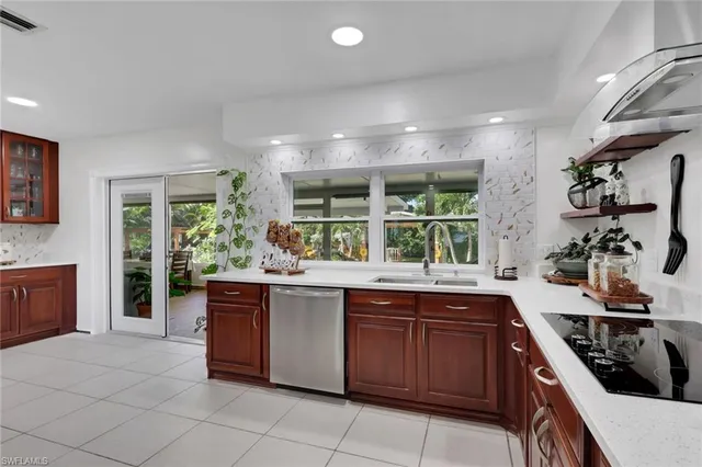a large kitchen with a table and chairs