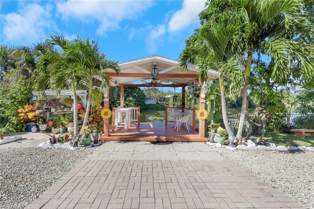 4983 18th Court Southwest Naples, FL 34116 - Photo 3 of 37 a view of street with sitting area