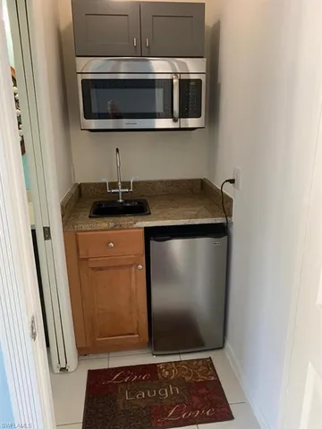 a bathroom with a shower a toilet and a sink