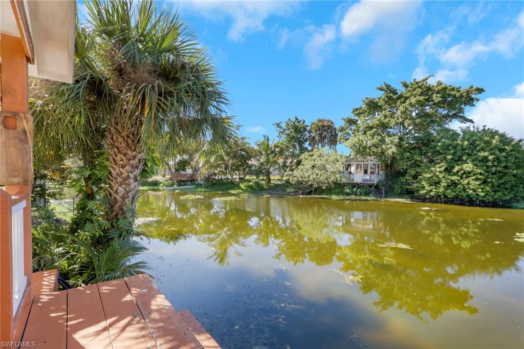 4983 18th Court Southwest Naples, FL 34116 - Photo 8 of 37 a view of a lake with a yard