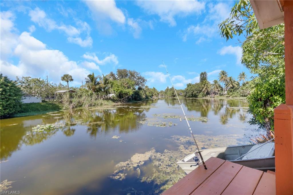 4983 18th Court Southwest Naples, FL 34116 - Photo 9 of 37 a view of a lake with a mountain