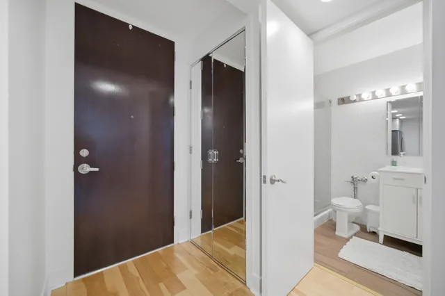 a view of a bathroom from the hallway