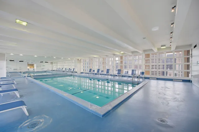 a view of a swimming pool and seating area