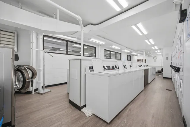 a view of living room with furniture and washer