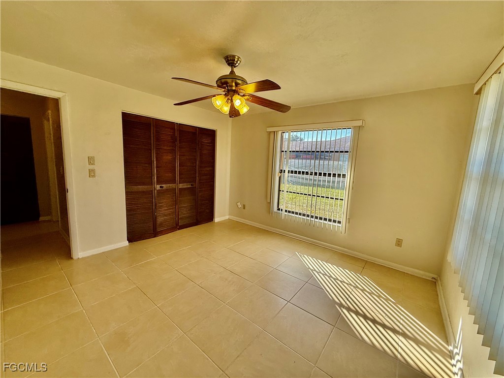 24 Clayton Avenue Lehigh Acres, FL 33936 - Photo 21 of 28 a view of an empty room with a window
