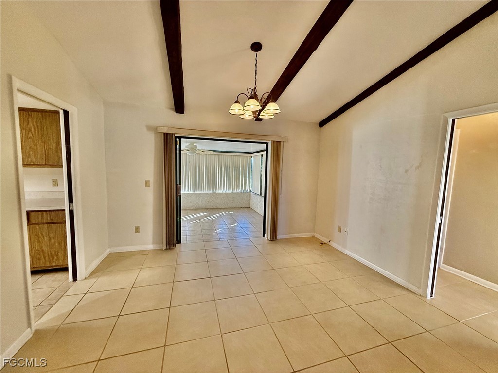 24 Clayton Avenue Lehigh Acres, FL 33936 - Photo 7 of 28 a view of an entryway with wooden floor