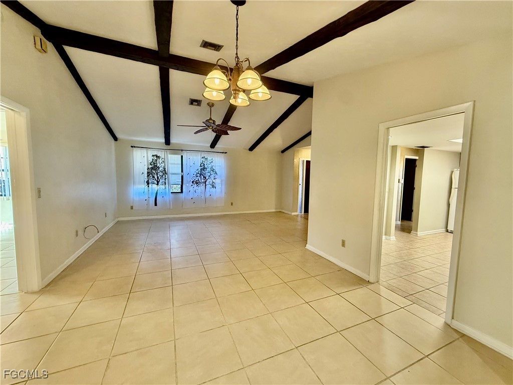24 Clayton Avenue Lehigh Acres, FL 33936 - Photo 8 of 28 a view of an entryway with a chandelier