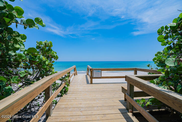 209 Southeast 3rd Street Satellite Beach, FL 32937 - Photo 23 of 25 a balcony with wooden floor