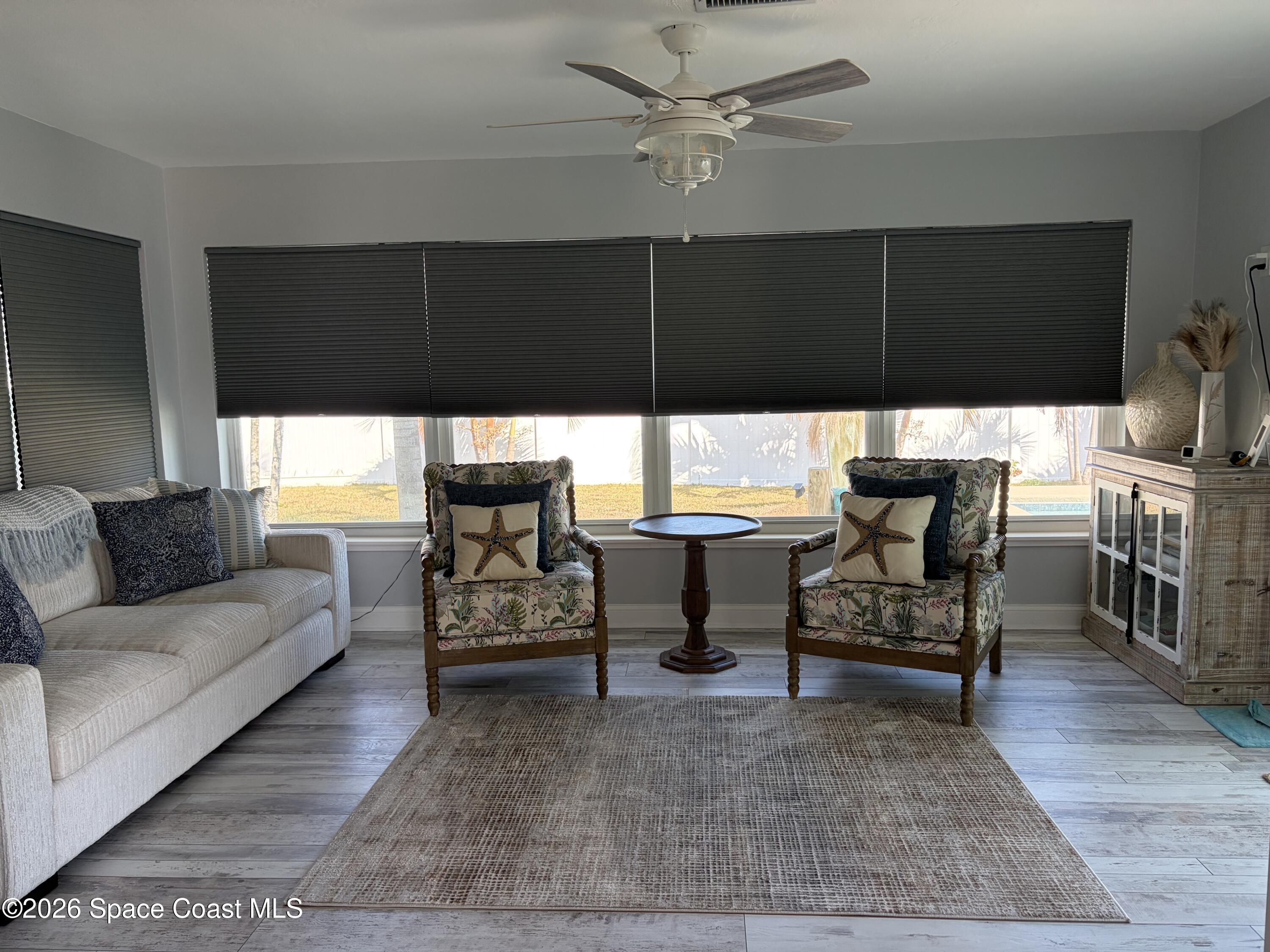 209 Southeast 3rd Street Satellite Beach, FL 32937 - Photo 6 of 25 a living room with furniture and a flat screen tv