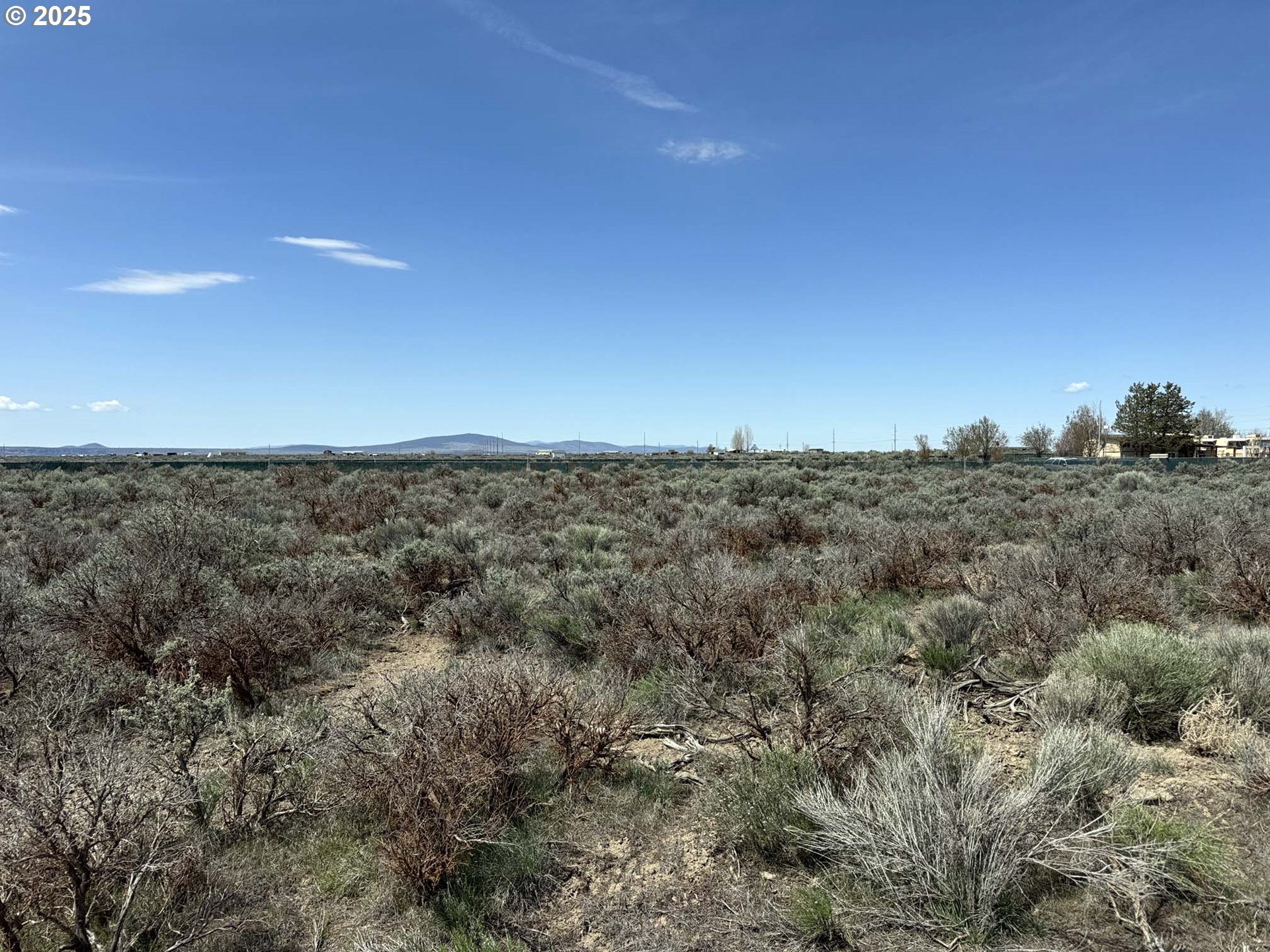 Tinsel Road, Unit 2600 Christmas Valley, OR 97641 - Photo 17 of 20 a view of a big room with a mountain in the background