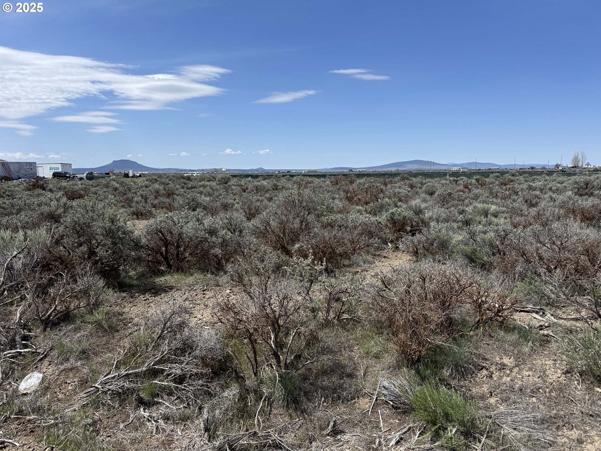Tinsel Road, Unit 2600 Christmas Valley, OR 97641 - Photo 20 of 20 a view of a dry yard with lots of trees
