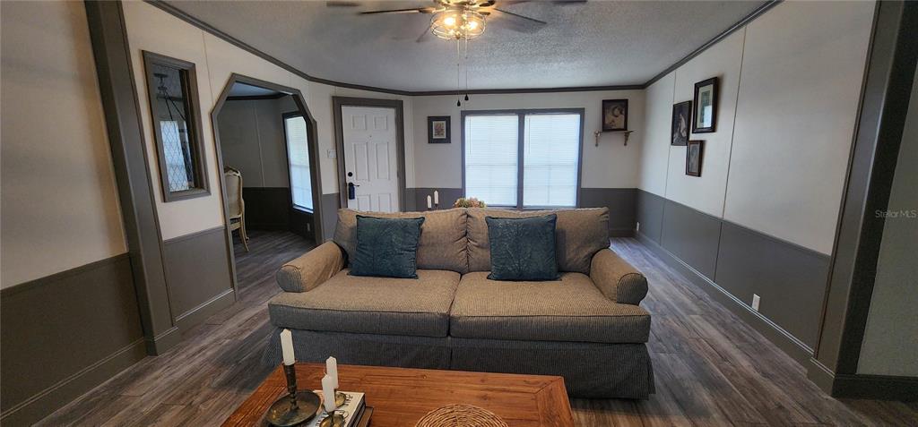 19865 Southwest 5th Place Dunnellon, FL 34431 - Photo 19 of 78 a living room with furniture and a lamp