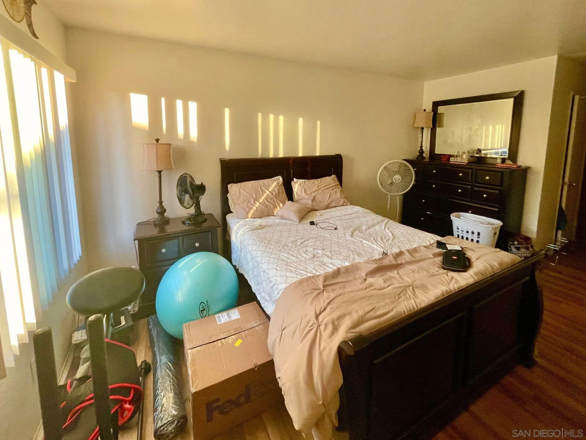 5970 Rancho Mission Road, Unit 244 San Diego, CA 92108 - Photo 11 of 21 a bed room with a bed window and dresser
