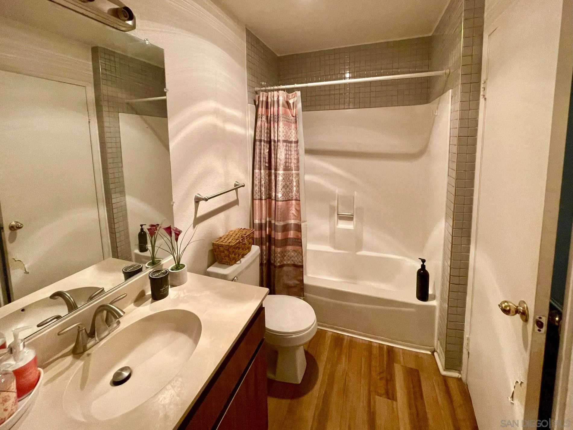 5970 Rancho Mission Road, Unit 244 San Diego, CA 92108 - Photo 14 of 21 a bathroom with a sink and a mirror
