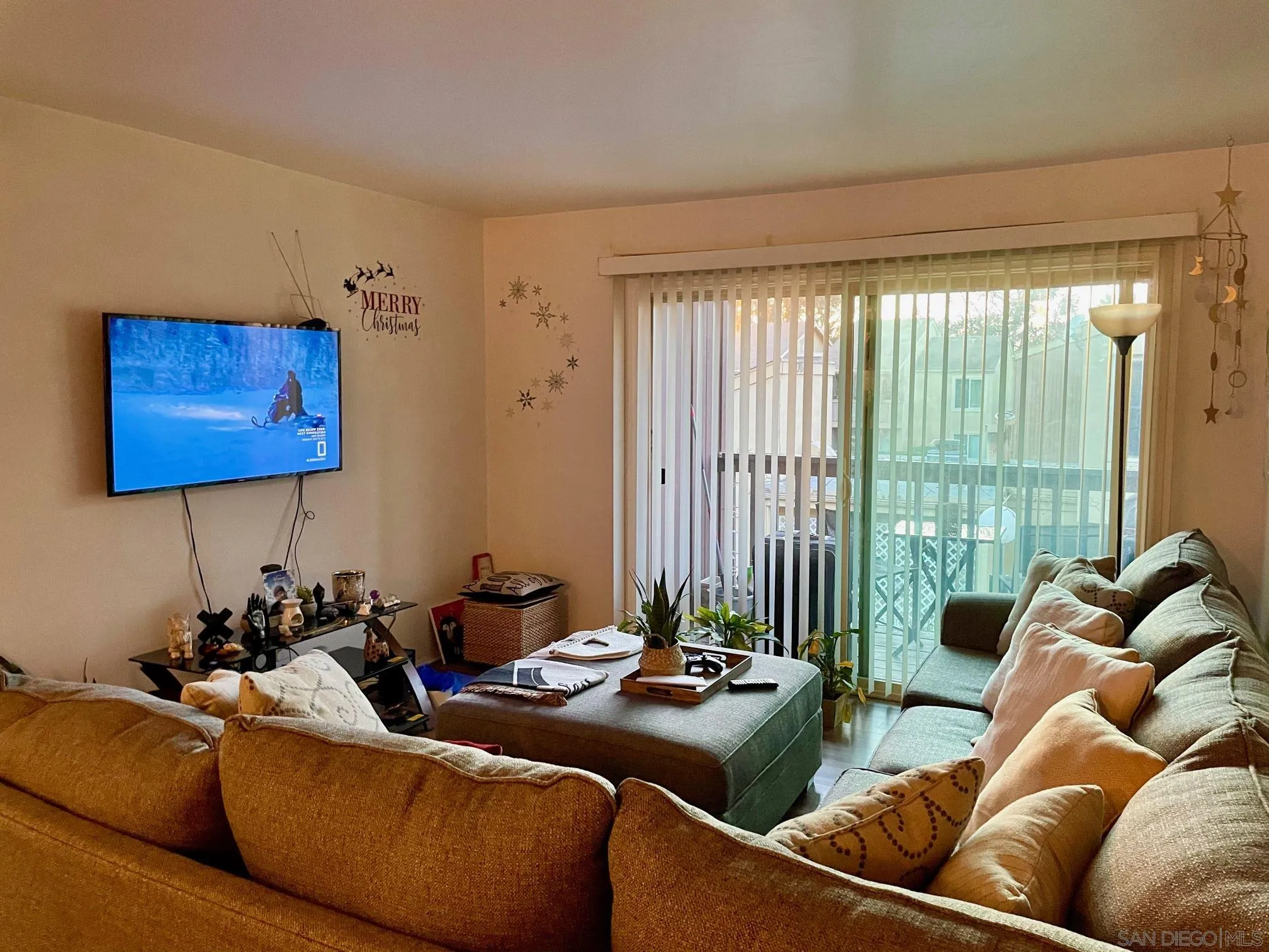 5970 Rancho Mission Road, Unit 244 San Diego, CA 92108 - Photo 15 of 21 a living room with furniture and a large window