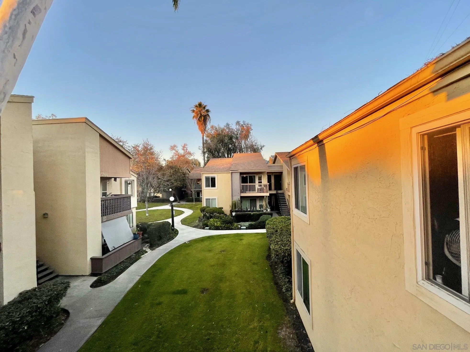 5970 Rancho Mission Road, Unit 244 San Diego, CA 92108 - Photo 17 of 21 a view of a house with a backyard