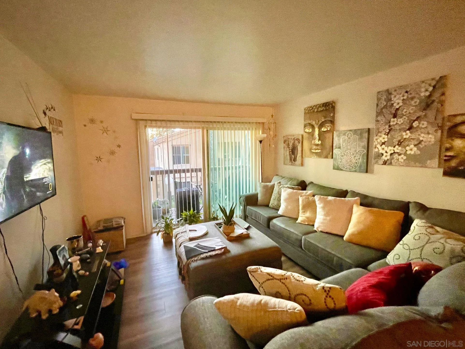 5970 Rancho Mission Road, Unit 244 San Diego, CA 92108 - Photo 2 of 21 a living room with furniture and a flat screen tv