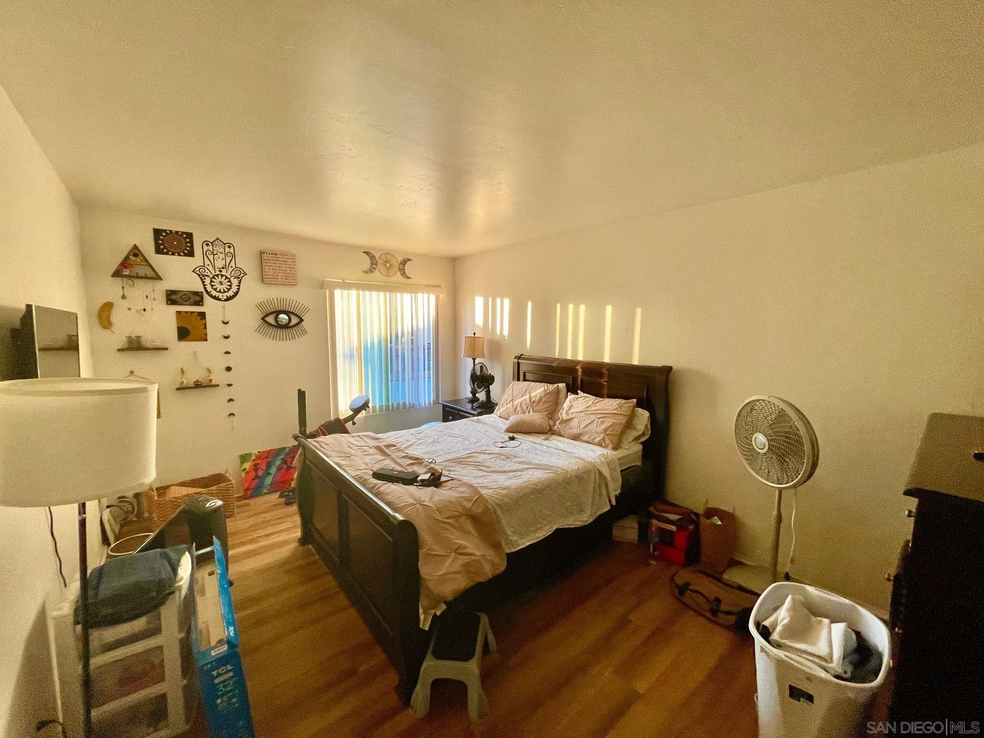 5970 Rancho Mission Road, Unit 244 San Diego, CA 92108 - Photo 3 of 21 a bed room with a bed and a table