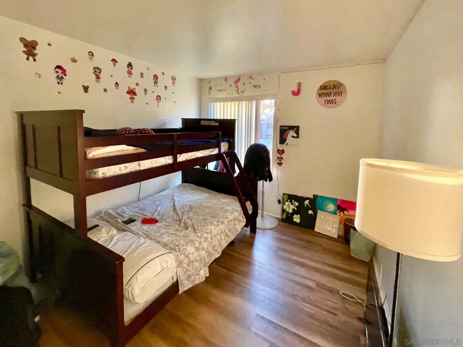 5970 Rancho Mission Road, Unit 244 San Diego, CA 92108 - Photo 10 of 21 a bedroom with a bed and wooden floor