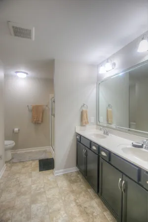 a bathroom with a glass shower door